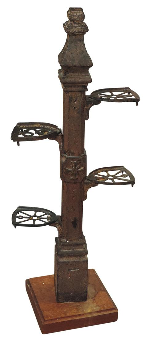 Primitive Plant Stand, cast iron assembly of fence post mounted w/4 sad iron trivet/shelves on wood (1 of 1)