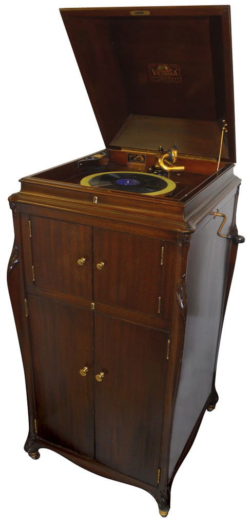 Victrola, mfgd by Victor Talking Machine Co.-Camd: Victrola, mfgd by Victor Talking Machine Co.-Camden, NJ, walnut, plays great, Exc orig cond, 60"H x 20"W, comes w/a 1915 Saturday Evening Post framed ad showing this same record player, 18.5"H x 24.5"