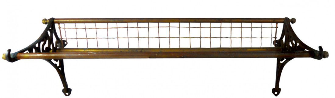 Railroad depot coat/hat rack, fancy cast iron and: Railroad depot coat/hat rack, fancy cast iron and copper w/traces of orig copper flashing, "NSW" cutout casting on both ends, Exc cond w/break on one of 6 mounting holes, 11"H x 29"W x 13.5"D.