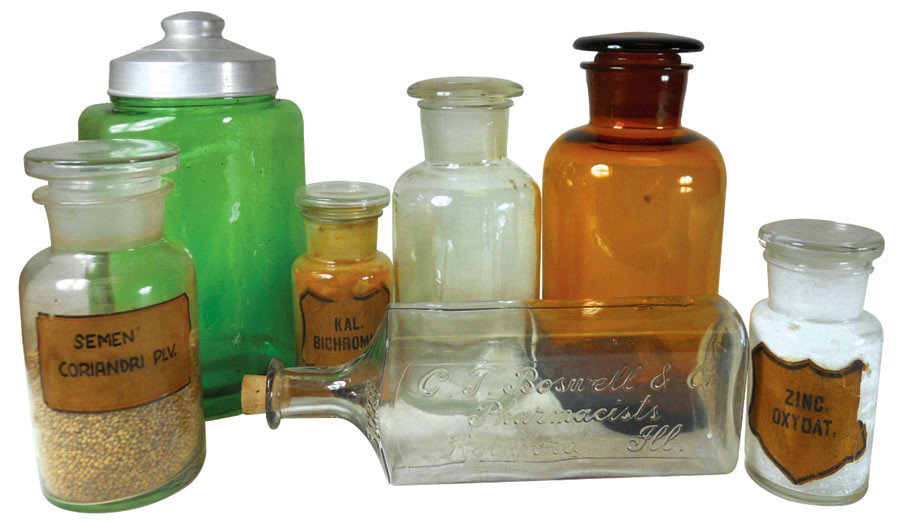 Drug store apothecary bottles (7), large brown bo: Drug store apothecary bottles (7), large brown bottle w/ground stopper, embossed C.T. Boswell & Co. Pharmacists-Rockford, Ill, Evenrite w/cork lid, green curved-front w/wide neck & metal lid, round w/