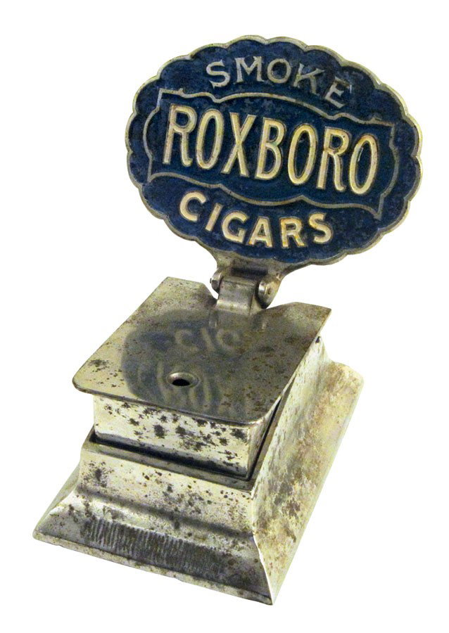Cigar cutter, Roxboro, mfgd by Brunhoff, nickel-plated : Cigar cutter, Roxboro, mfgd by Brunhoff, nickel-plated cast iron, push down to cut end off cigar, Exc orig cond, 8"H x 6"W.