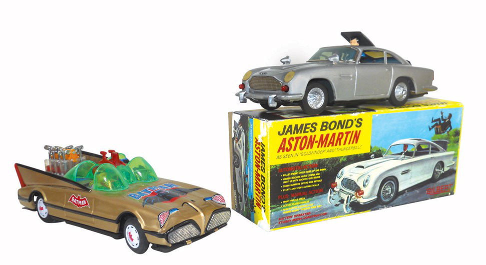 Toy cars (2), James Bond's Aston-Martin w/box & Batman : Toy cars (2), James Bond's Aston-Martin w/box & Batman battery-operated cars, metal & molded plastic, Bond has ejector seat & is mfgd by Gilbert, VG cond & 11.5"L, Batman car is complete w/Batman & Ro