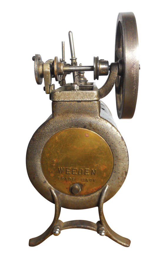 Toy, Weeden steam engine, cast iron, brass & sheet meta: Toy, Weeden steam engine, cast iron, brass & sheet metal, 2 cutout stars, VG cond w/some re-solder on valve end, 10"H x 9"W.
