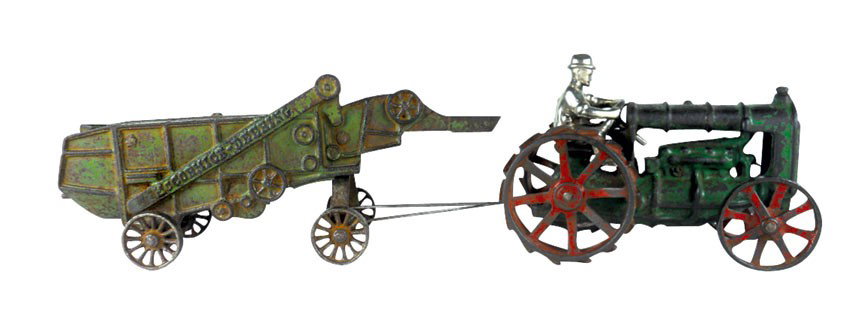 Farm toys (2), Arcade McCormick-Deering thresher, green: Farm toys (2), Arcade McCormick-Deering thresher, green w/spoke wheels, integral front chute, missing side chute, orig green paint & Arcade decal, 9.5"L & Fordson tractor, green w/red cleated wheels &