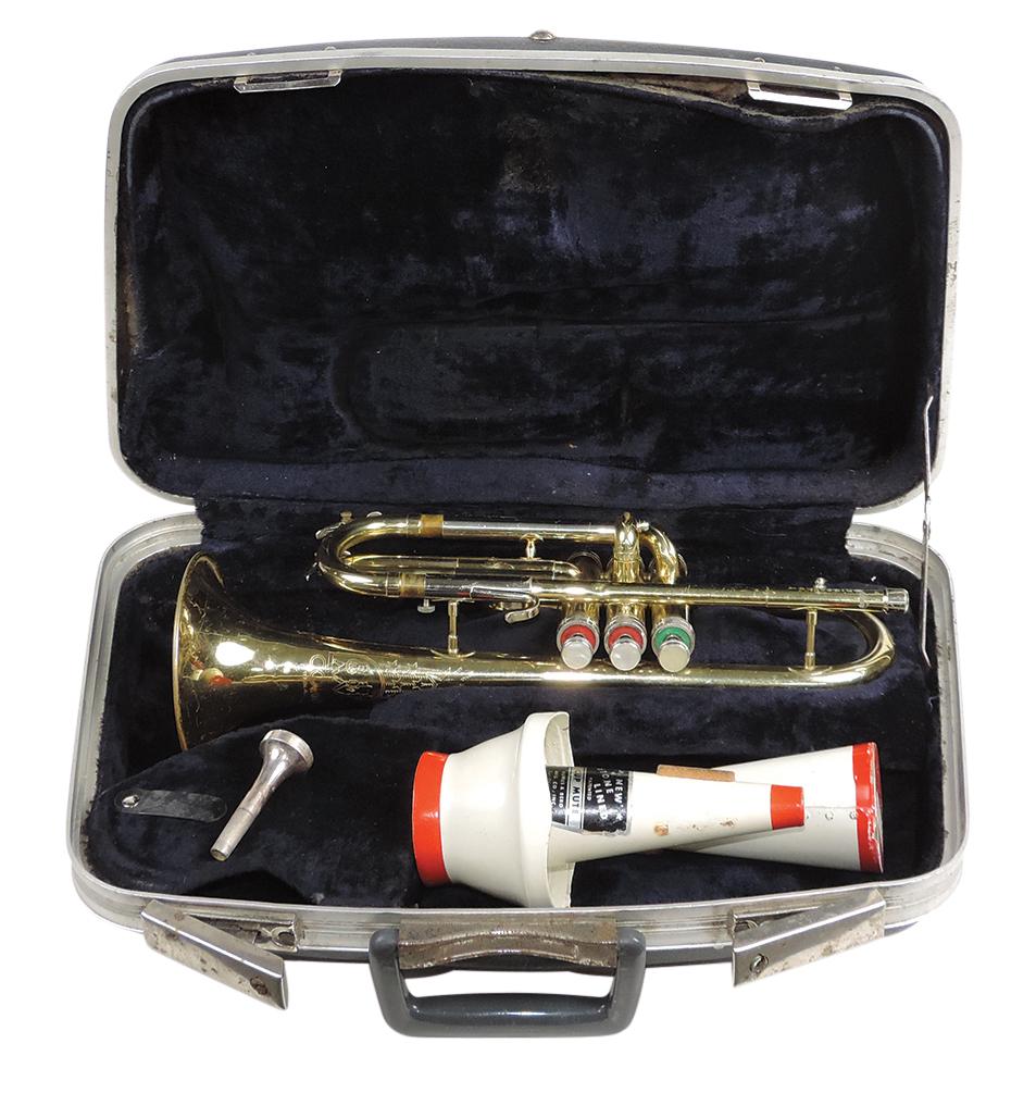 Musical Instrument, band trumpet, mfgd by Conn, Ser. #H02903, brass, c.1980, 15"L w/4.875" bell,: Musical Instrument, band trumpet, mfgd by Conn, Ser. #H02903, brass, c.1980, 15"L w/4.875" bell, mouthpiece & 2 mutes, VG+ untested cond w/some dings to bell, in matching 18"L case.