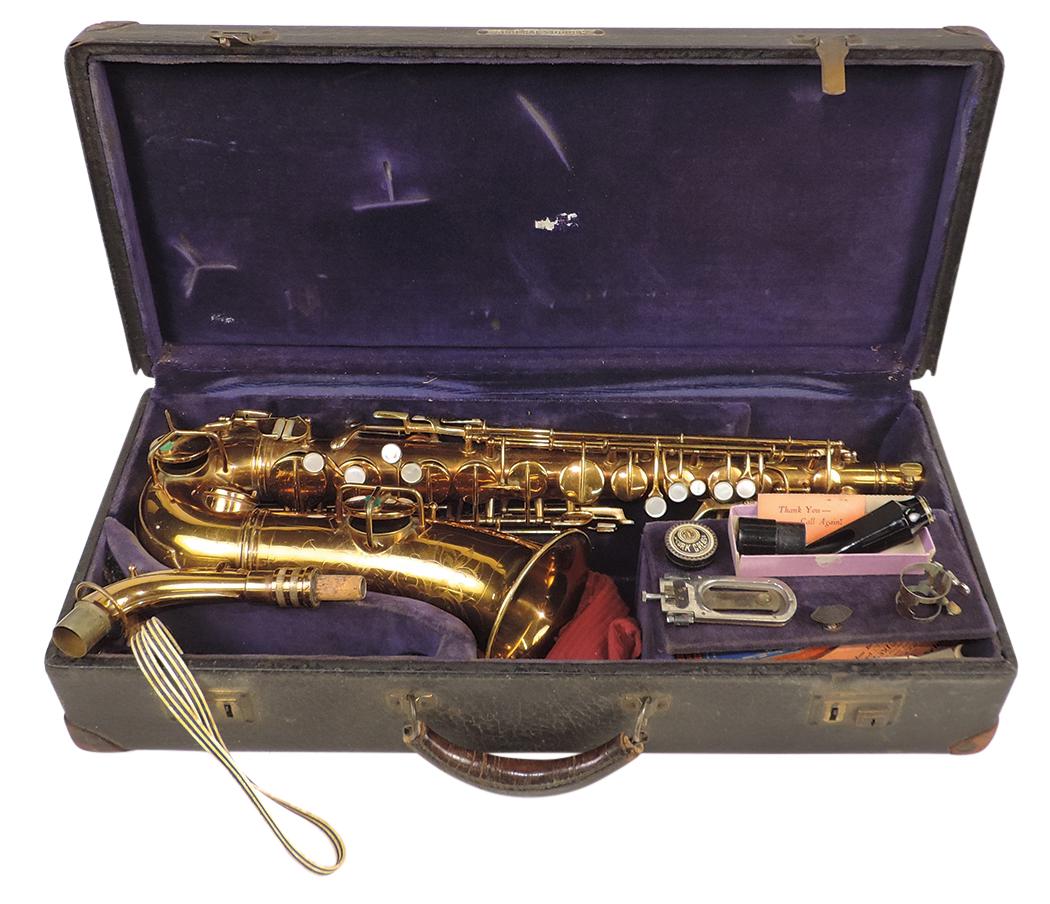 Musical Instrument, alto saxophone, mfgd by Conn, Ser. #M220508, rose gold plated brass w/MOP keys,: Musical Instrument, alto saxophone, mfgd by Conn, Ser. #M220508, rose gold plated brass w/MOP keys, c.1929, 25"L w/4.75" bell, Exc untested cond in Conn case named to Albert Soucek, 23.5"L.