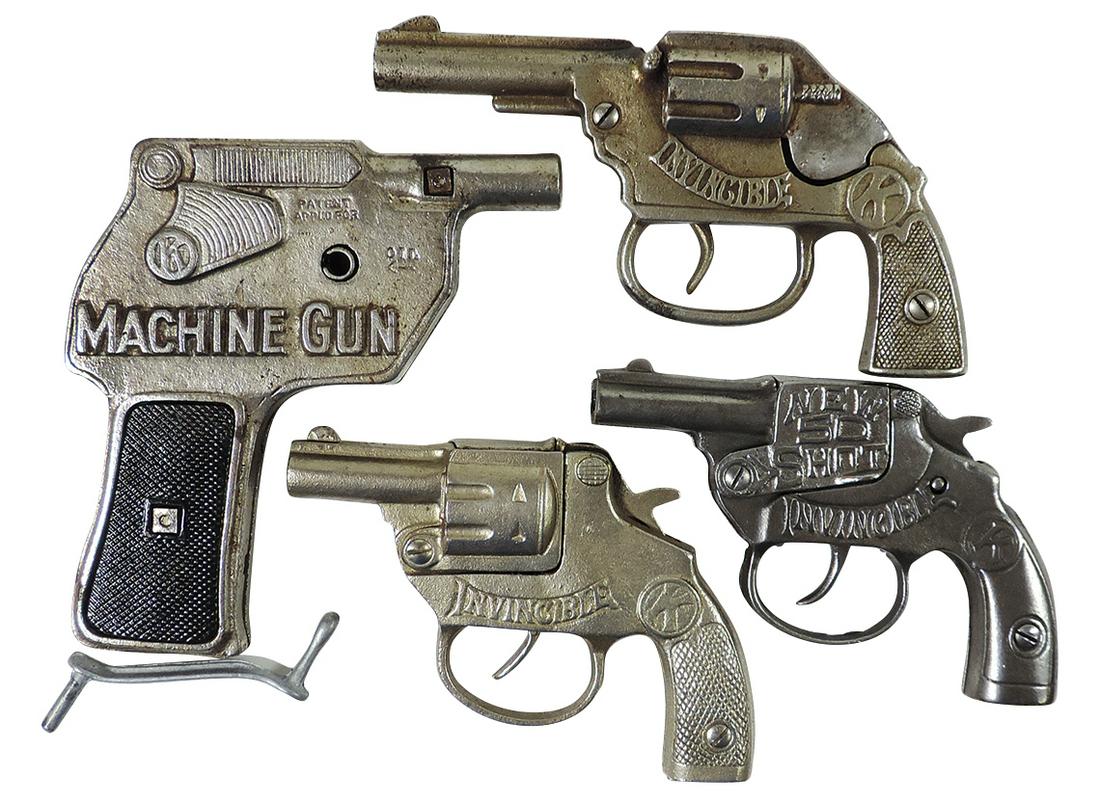 Toy Cap Pistols (4), mfgd by Kilgore, includes Invincible New 50 Shot & Machine Gun, cast: Toy Cap Pistols (4), mfgd by Kilgore, includes Invincible New 50 Shot & Machine Gun, cast iron, VG working cond, largest 7.5"L.