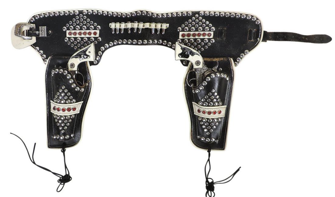 Toy Cap Gun & Holster Set, Texan Jr, mfgd by Hubley, studded & jeweled black/white holsters,: Toy Cap Gun & Holster Set, Texan Jr, mfgd by Hubley, studded & jeweled black/white holsters, die-cast metal & leather, VG working cond, 16"H x 34"W.