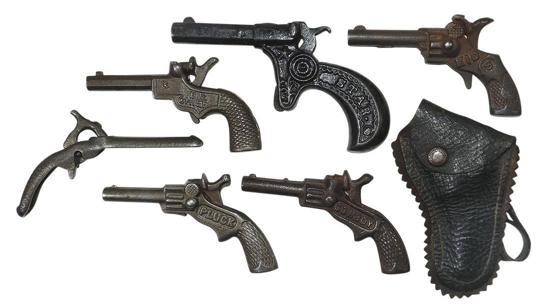 Toy Cap Pistols & Holster (7), miniatures, includes Stevens Pluck, Cowboy, Star & Big Chief,: Toy Cap Pistols & Holster (7), miniatures, includes Stevens Pluck, Cowboy, Star & Big Chief, cast iron, VG working cond, largest 5"L.