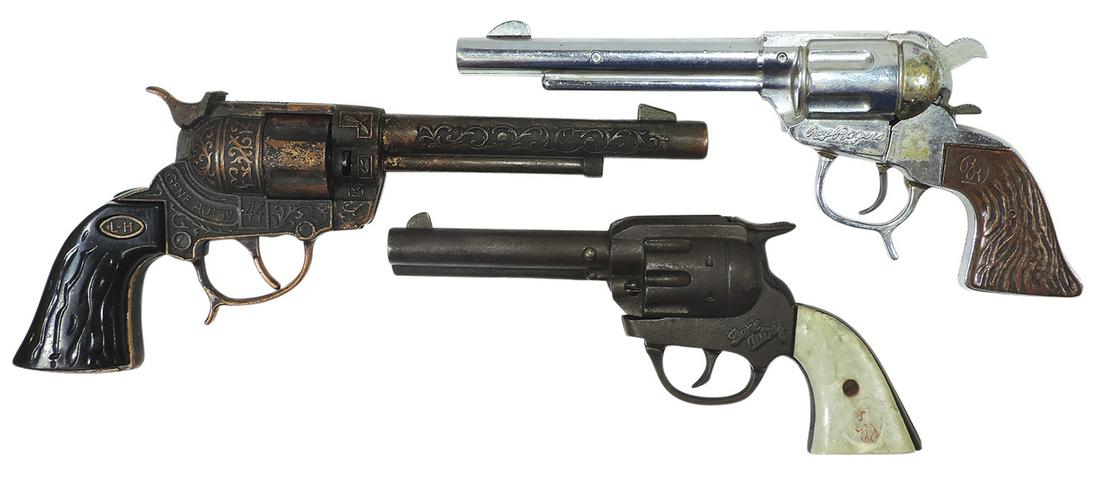 Toy Cap Pistols (3), Roy Rogers & Gene Autry, die-cast & Gene Autry "Dummy" by Stevens, cast iron,: Toy Cap Pistols (3), Roy Rogers & Gene Autry, die-cast & Gene Autry "Dummy" by Stevens, cast iron, VG cond w/RR not working, largest 12"L.