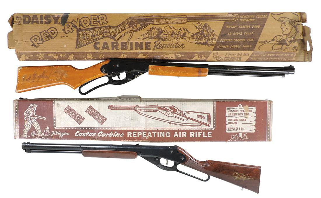 Air Rifles (2), Red Ryder carbine w/wood stock & J.C. Higgins Cactus carbine, both mfgd by Daisy in: Air Rifles (2), Red Ryder carbine w/wood stock & J.C. Higgins Cactus carbine, both mfgd by Daisy in orig boxes, Good+ cond (missing saddle ring & thong) & VG+ cond, both working, larger 36"L.