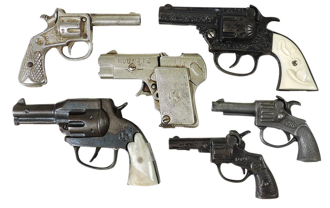 Toy Cap Pistols (6), mfgd by Kilgore & Stevens, includes Mountie Bulls Eye, Dog, Hi-Ho: Toy Cap Pistols (6), mfgd by Kilgore & Stevens, includes Mountie Bulls Eye, Dog, Hi-Ho & others, cast iron, VG to Exc working cond, largest 7.5"L.
