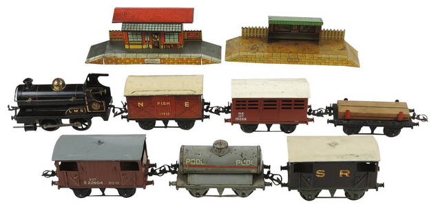 Toy Freight Train (9 pcs), mfgd by Hornby, LMS loco, 3 box cars, tanker, lumber, depot & waiting: Toy Freight Train (9 pcs), mfgd by Hornby, LMS loco, 3 box cars, tanker, lumber, depot & waiting platforms, litho on tin windup, Good+ to VG cond w/loco Exc working cond, largest 10"L.