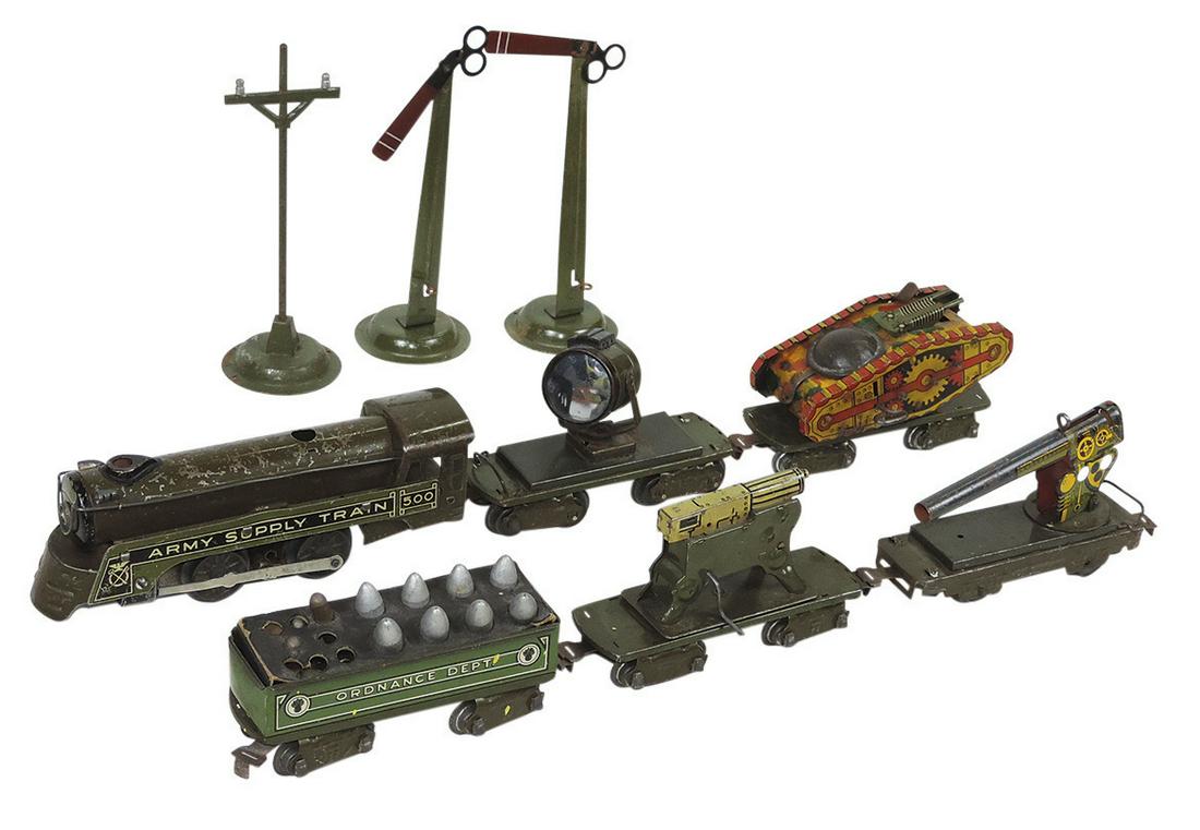 Toy Electric Army Supply Train Set (9), mfgd by Marx, incl 500 loco, windup tank, searchlight,: Toy Electric Army Supply Train Set (9), mfgd by Marx, incl 500 loco, windup tank, searchlight, artillery, ordnance & machine gun on flatbeds plus 2 signals & telegraph pole, litho on tin, Good or bett