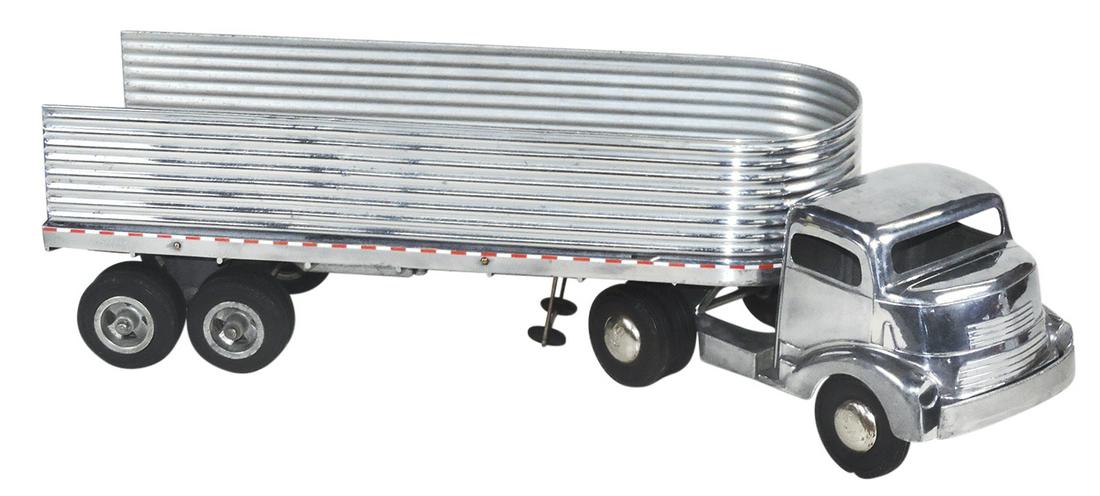Toy GMC Truck & Fruehauf Trailer, mfgd by Smith-Miller for Smitty Toys, polished aluminum, VG cond,: Toy GMC Truck & Fruehauf Trailer, mfgd by Smith-Miller for Smitty Toys, polished aluminum, VG cond, noting rear gate absent, 24"L as shown.