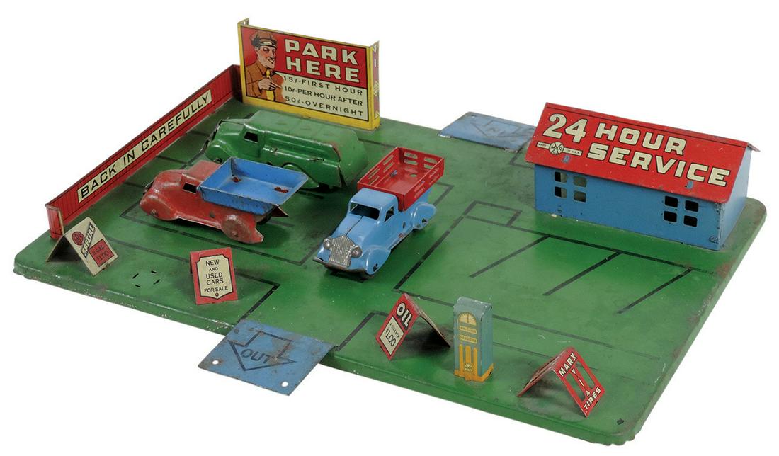 Toy Service Station, mfgd by Marx w/buildings & 3 trucks, pressed steel & litho on tin, VG cond w/1 (1 of 2)