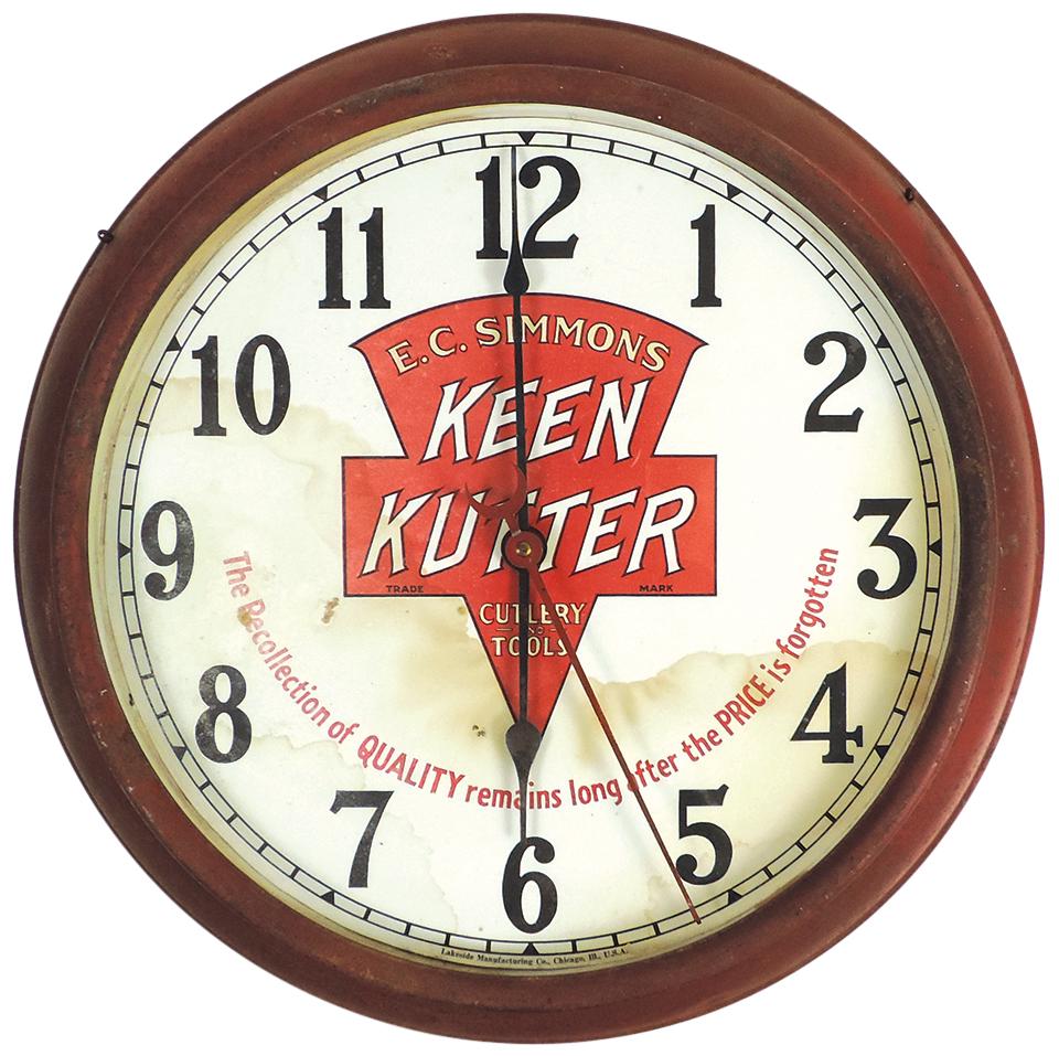 Hardware Store Clock, Keen Kutter w/later fantasy face print, pressed metal bezel w/electric: Hardware Store Clock, Keen Kutter w/later fantasy face print, pressed metal bezel w/electric movement, VG working cond w/aged appearance, 19"Dia.