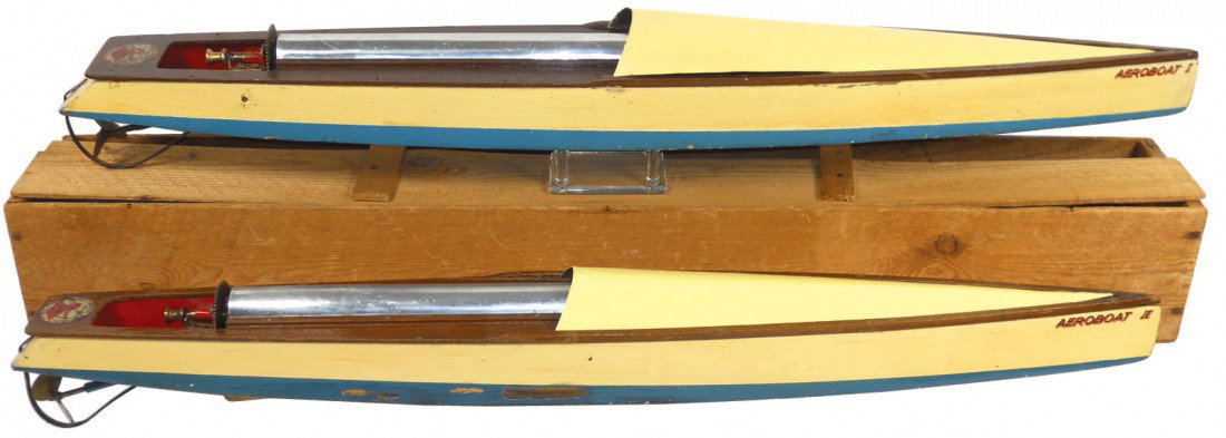 Toy boats (2), Bowman Aeroboat I & II, mfgd in En: Toy boats (2), Bowman Aeroboat I & II, mfgd in England, rubber-band powered, wood w/metal decks, one has a wood box w/missing lid, c.1930's, VG cond w/repainted decks, ea. 30"L.