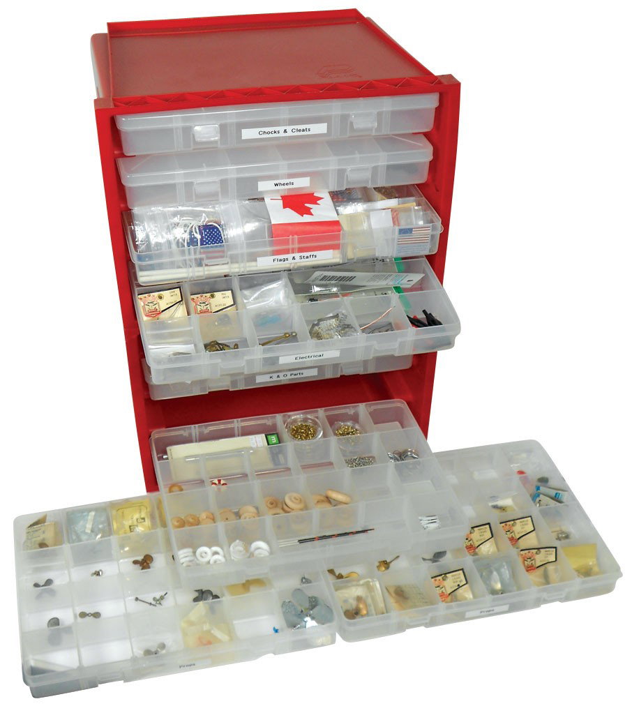 Toy boat parts, propellers, flags & staffs, elect: Toy boat parts, propellers, flags & staffs, electrical parts, a few steering wheels, K & O parts & cleats & chocks, all come w/a plastic drwr unit.