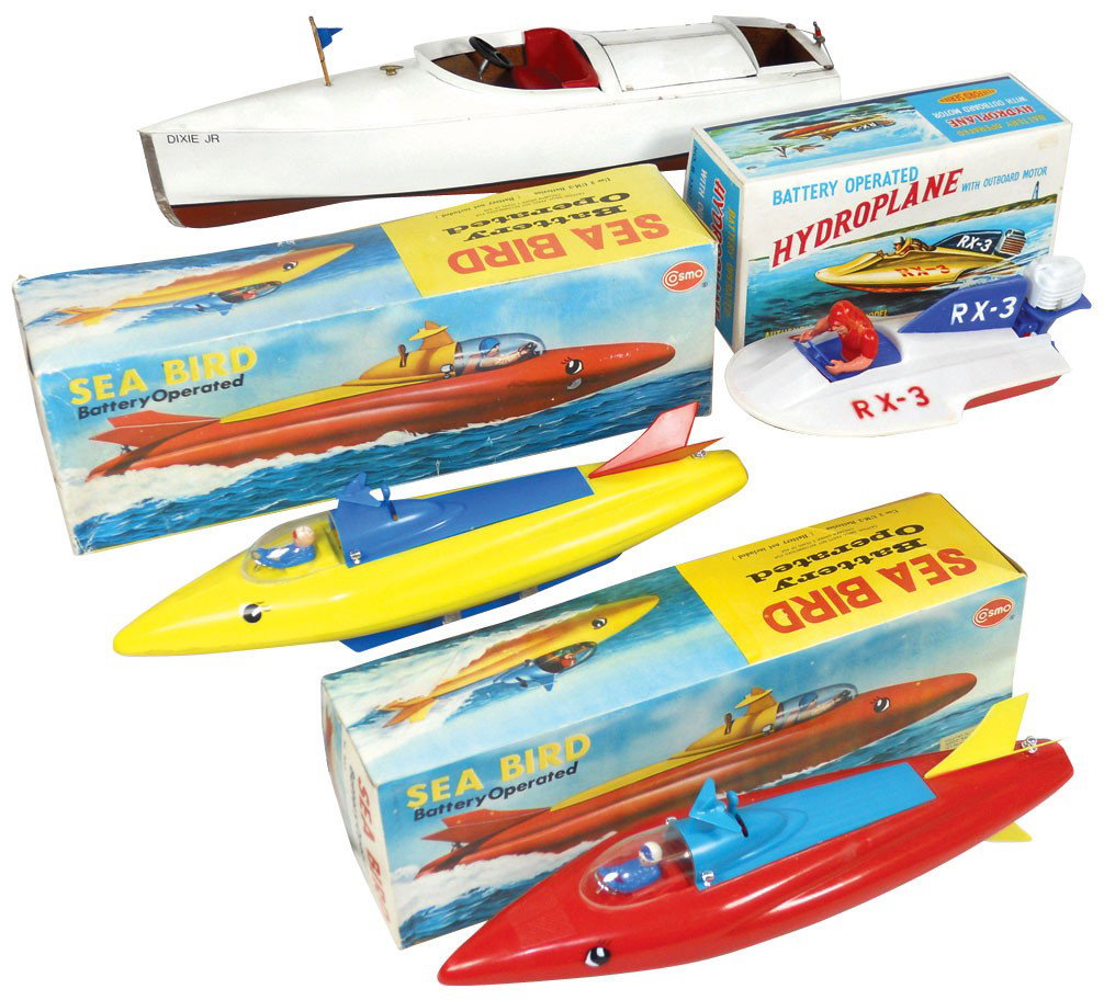 Toy boats (4), custom Dixie Jr. inboard speed boa: Toy boats (4), custom Dixie Jr. inboard speed boat, c.1920, Exc cond, 16"L, plastic hydroplane w/box, like-new cond, 8"L & 2 plastic hydroplane Sea Birds w/boxes, like-new cond, 13"L.