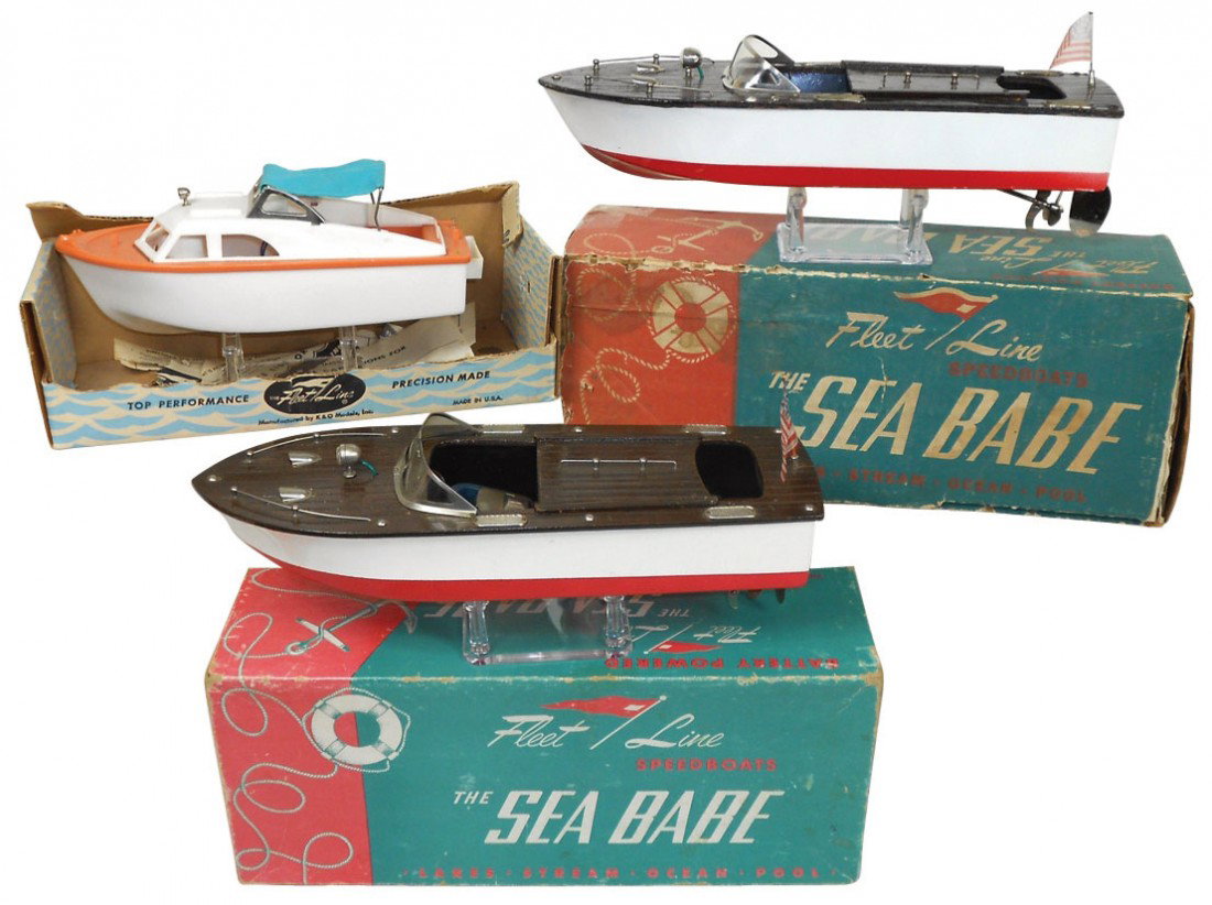 Toy boats (3), Fleet Line Sea Babes (2) w/orig bo: Toy boats (3), Fleet Line Sea Babes (2) w/orig boxes, wood, one Near-Mint in VG box, other VG to Exc cond in Fair to Good cond box, both 12.5"L & plastic Fleet Line El Capitan, missing flag, o/wise Ex