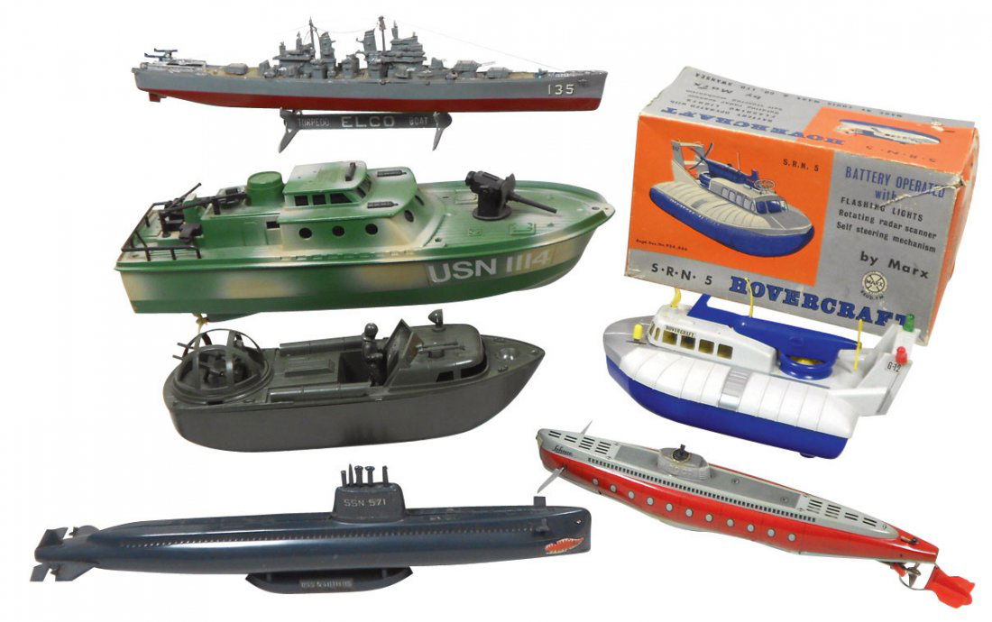 Toy boats (6), Marx Hovercraft w/box, Exc, USN 11: Toy boats (6), Marx Hovercraft w/box, Exc, USN 1114, 135, SSN 571, submarine, patrol boat & Schuco metal & plastic sub #3007, all VG & Exc cond, 9" to 16"L.