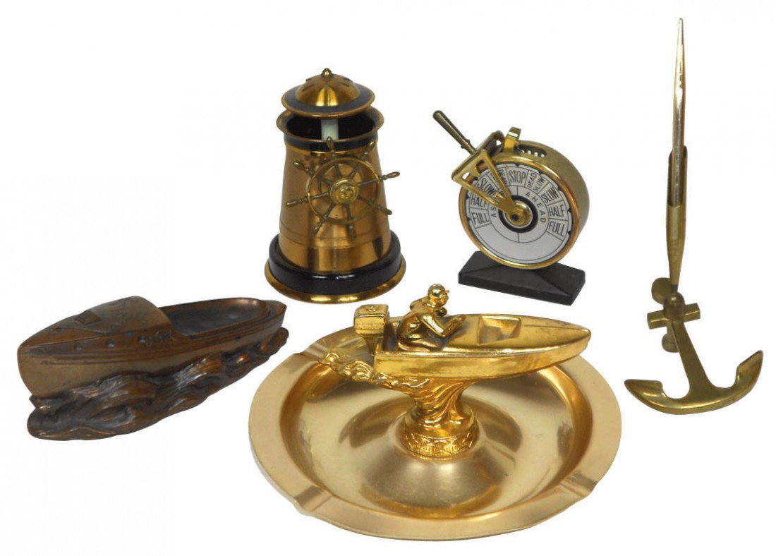 Nautical smoking & desk accessories (5), ship's w: Nautical smoking & desk accessories (5), ship's wheel cigarette/cigar lighter (works), rowboat inkwell (broken glass insert), speedboat ashtray, anchor desk pen & ship's wheel cigarette holder, all ar
