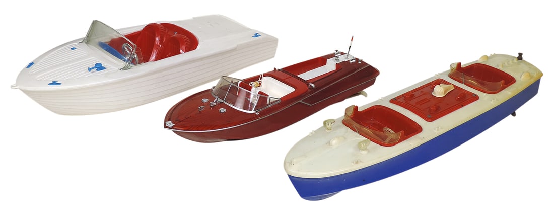 Toy Boats (3), Harcraft, made in Los Angeles, large red/white/blue plastic, 2 B-O, later: Toy Boats (3), Harcraft, made in Los Angeles, large red/white/blue plastic, 2 B-O, later wood-grained runabout & an unmarked pull/floor toy, VG to Exc cond, the latter missing deck piece, largest 21"L