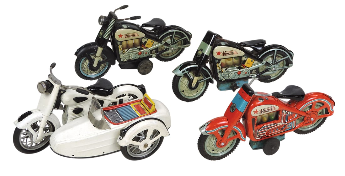Toy Motorcycles (4), 1960's Japan, 3 Venus, mfgd by Nomura & white & black sidecar w/siren mfgd by: Toy Motorcycles (4), 1960's Japan, 3 Venus, mfgd by Nomura & white & black sidecar w/siren mfgd by Marusan, litho on tin friction in VG to Exc cond, one w/drive wheels absent, largest 9.5"L.