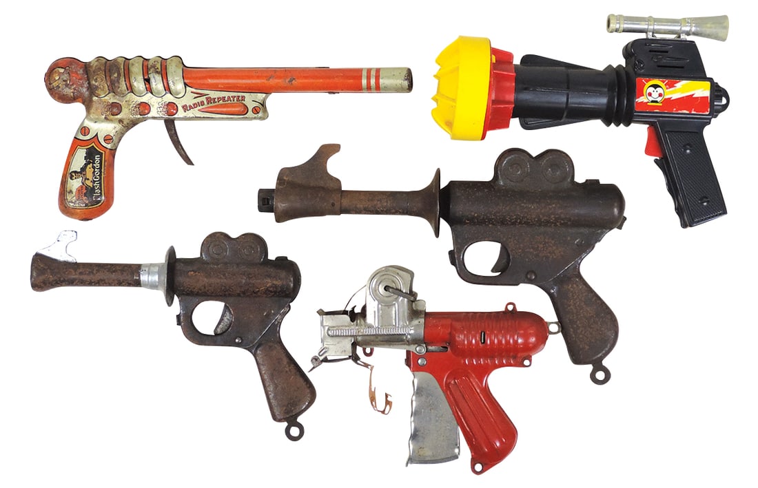 Toy Space Pistols (5), pressed steel Buck Rogers in 2 sizes, Nu-matic Cap Gun, litho on tin Flash: Toy Space Pistols (5), pressed steel Buck Rogers in 2 sizes, Nu-matic Cap Gun, litho on tin Flash Gordon Radio Repeater & plastic B-O Laser Ray, Fair to Good cond, largest 10"H.