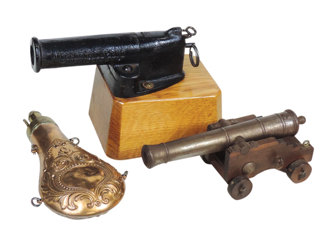 Firearms (3), French cast iron signal cannon for 12 ga. blanks, miniature black powder cannon &: Firearms (3), French cast iron signal cannon for 12 ga. blanks, miniature black powder cannon & copper powder flask, VG to Exc cond, largest 8.5"L.