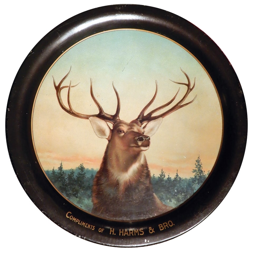 Hunting Tray, Compliments of H. Harms & Bro., litho on tin picturing large elk in woods, early: Hunting Tray, Compliments of H. Harms & Bro., litho on tin picturing large elk in woods, early 1900's, VG+ cond, 13.5"Dia.
