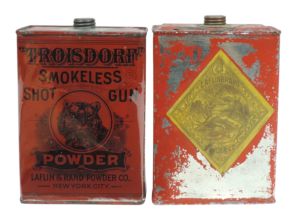 Gunpowder Cans (2), Orange Mills Lightning Powder w/paper label front & back, VG cond w/paint loss &: Gunpowder Cans (2), Orange Mills Lightning Powder w/paper label front & back, VG cond w/paint loss & Troisdorf Smokeless Shot Gun Powder w/wraparound graphic, Exc cond, both 1 lb & 5.5"H.
