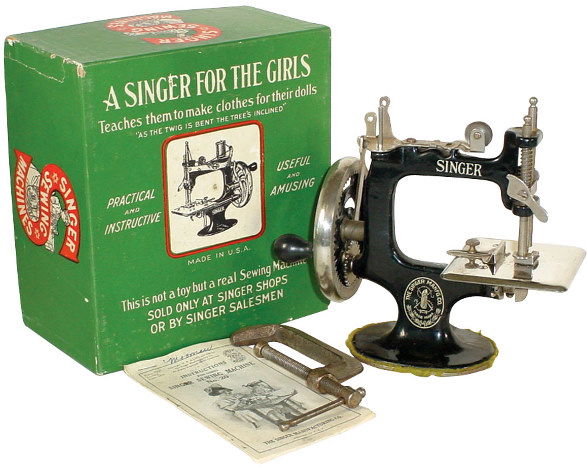 Child's sewing machine, cast iron Singer, "A Singe: Child's sewing machine, cast iron Singer, "A Singer for the Girls", "Not a toy but a real sewing machine", complete w/table clamp, instruction booklet & box, all VG condition, 7"H x 7"W.