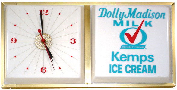 Dolly Madison Milk/Kemps Ice Cream light-up clock: Dolly Madison Milk/Kemps Ice Cream light-up clock, metal case w/molded plastic face, Exc. condition, 12"H x 24"W.