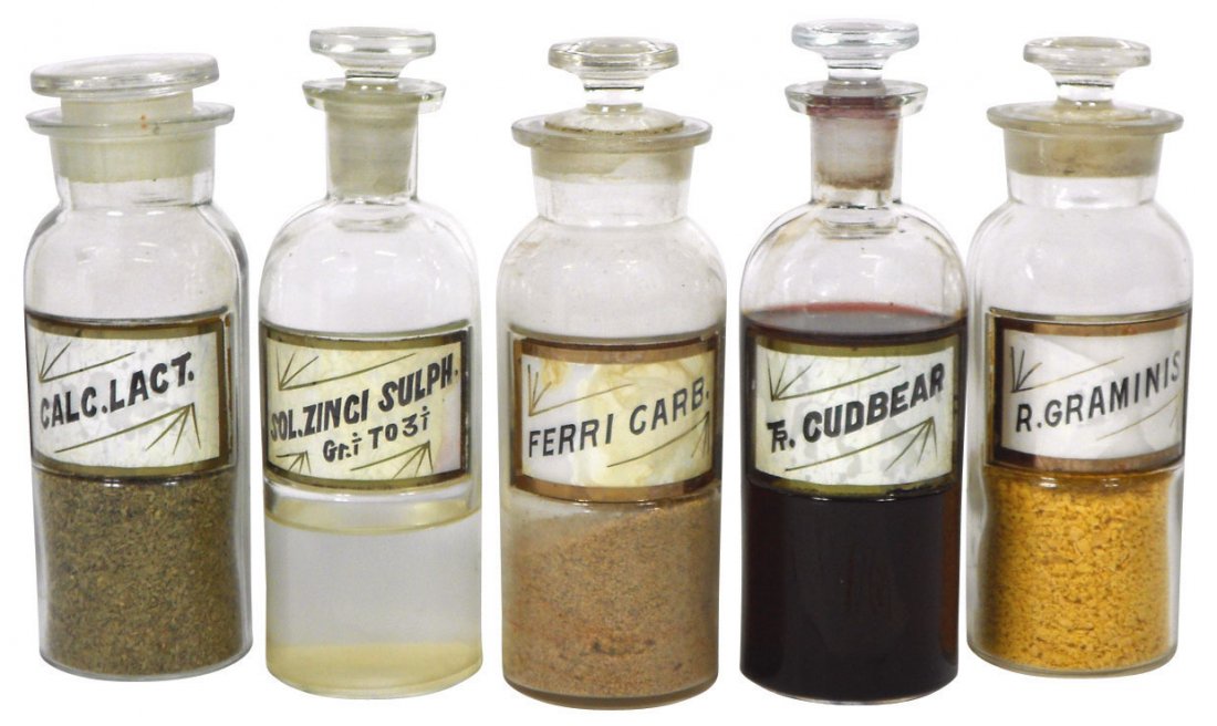 Apothecary jars (5) early round label-under-glass: Apothecary jars (5) early round label-under-glass jars, R. Graminis (chips on collar), Sol. Zinci Sulph, Ferri Carb (lg chips on neck of lid), Calc. Lact, Tr. Cudbear, VG to Exc cond unless noted, 7"H
