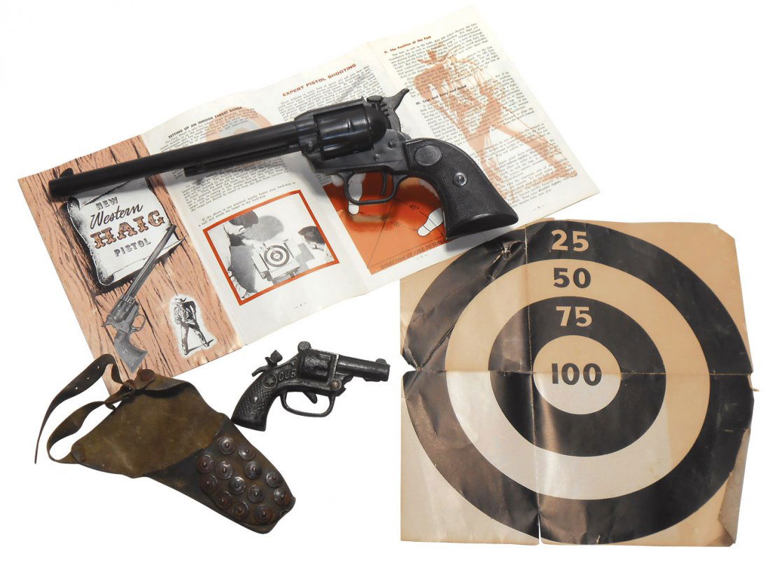 Toy guns (2), Western Haig, c.1960's, 12 cal, use: Toy guns (2), Western Haig, c.1960's, 12 cal, uses powder charge (small paper caps) to fire single BB, orig instructions & target, 13.5"Dia, Hubley, cast 4" "Cub" pistol w/holster, uses small paper ca