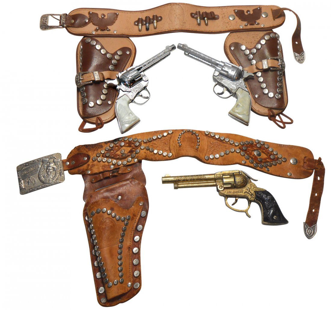 Toy guns (2), Roy Rogers, double holster set w/Ki: Toy guns (2), Roy Rogers, double holster set w/Kilgore pistols, both work, good grips, single holster set w/gold tone pistol, no hammer, good grip, Good to VG cond.