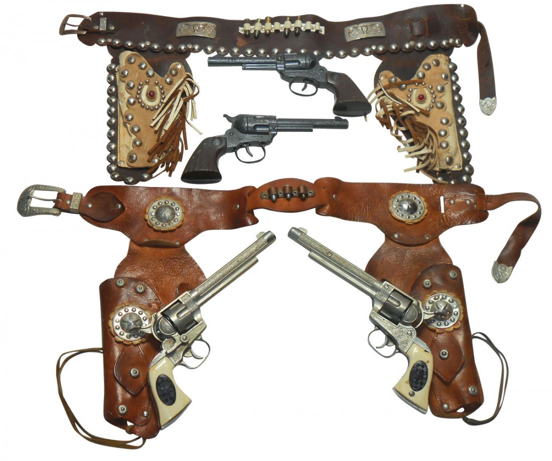 Toy guns, double holster sets (2), Hubley Marshal: Toy guns, double holster sets (2), Hubley Marshall pistols, work w/good grips, loose stitching & Daisy pistols, work w/good grips, both in Good cond.