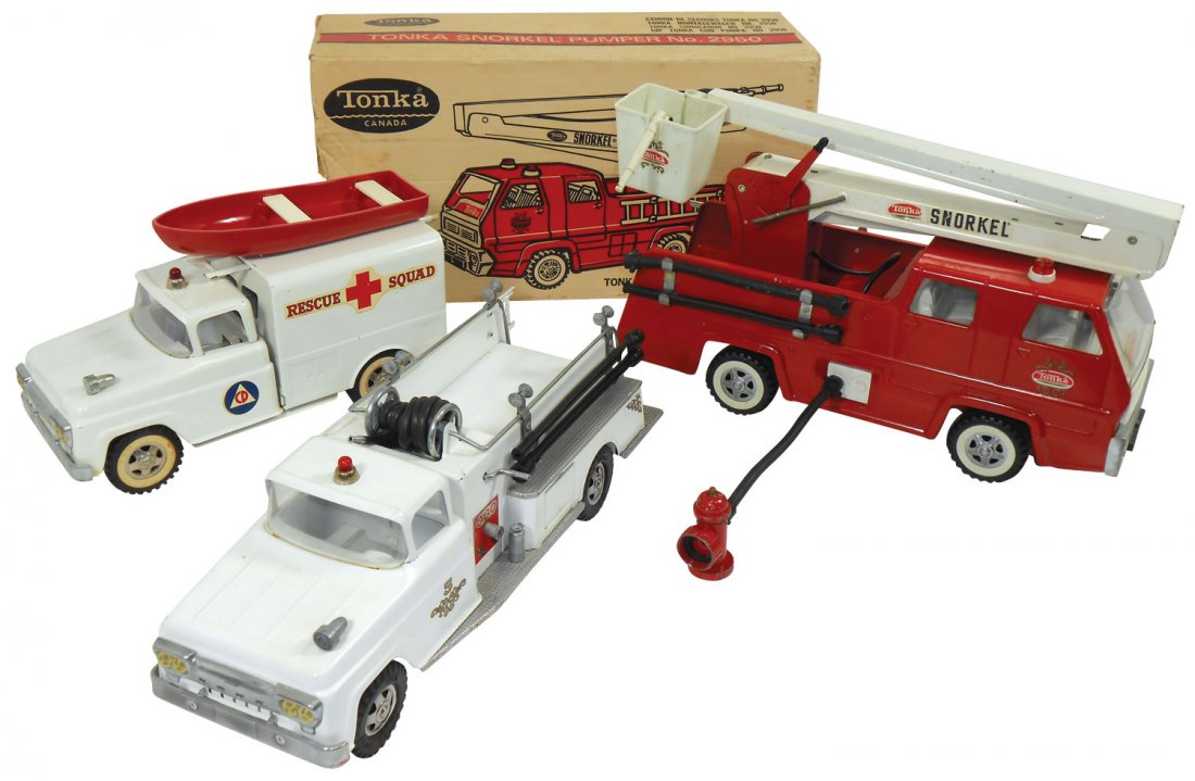 Toy Fire Engines (3), Tonka, Rare white pumper, h: Toy Fire Engines (3), Tonka, Rare white pumper, hoses, ladder, siren & dome light, Exc cond, Rescue squad, ladder w/boat, Exc cond & Canada truck, Near-Mint w/great box, 13" to 17"L.