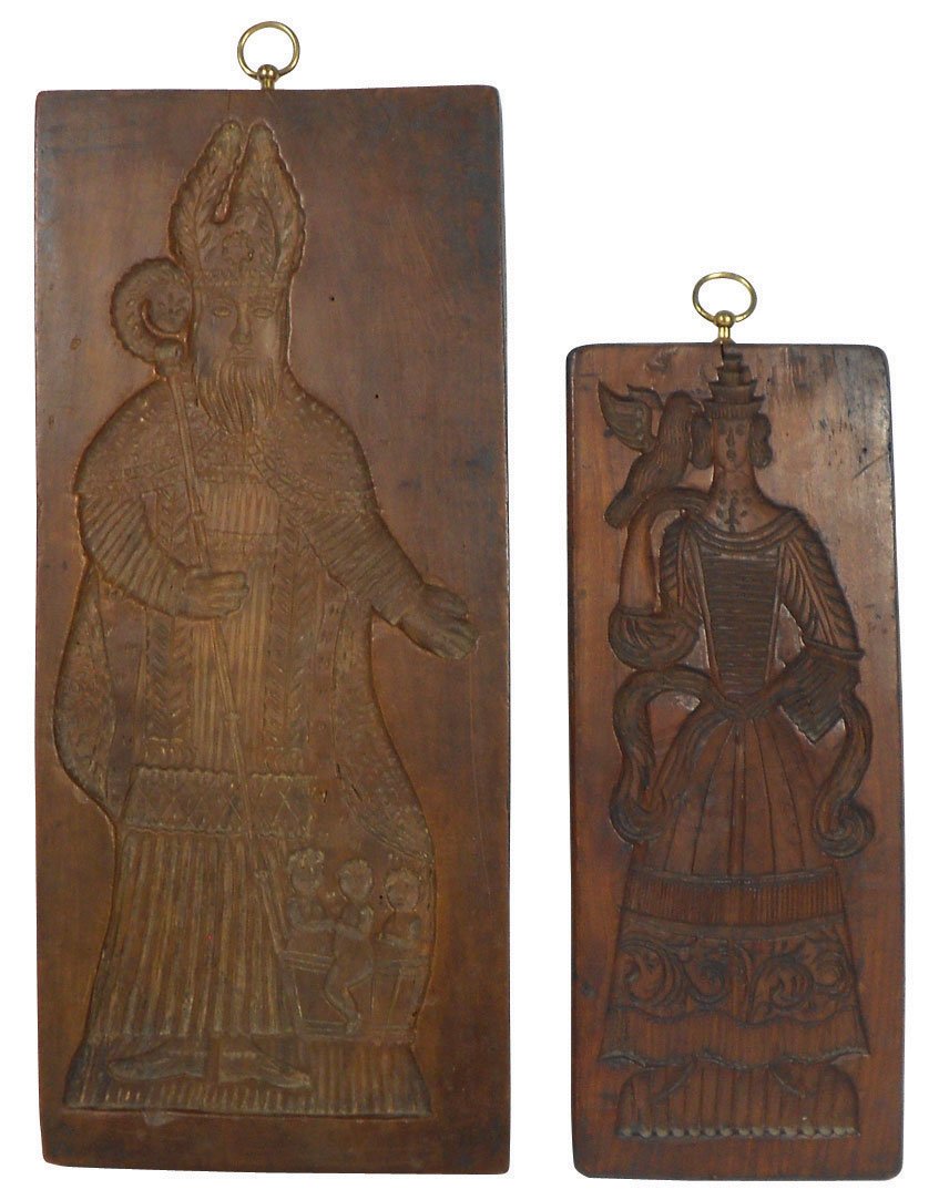 Primitive Scandinavian cookie boards (2), one 2-s: Primitive Scandinavian cookie boards (2), one 2-sided, woman w/bird & man w/walking stick, Exc cond, 14"H x 5.5"W & St. Nicholas carved cookie board, c.1800, Exc cond, 18"H x 7.75"W.