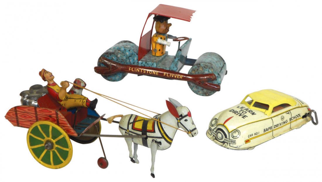 Toys (3), Marx Flintstone Flivver, tin friction,: Toys (3), Marx Flintstone Flivver, tin friction, c.1962, some wear on wheels, o/wise VG/Exc cond, 4"H x 7"L, Marx Hee Haw Milk Wagon, tin windup, VG cond, 10.5"L & Marx Safe Driving School windup car,