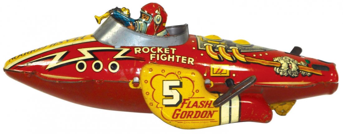 Toy, Flash Gordon Rocket Fighter, mfd by King Fea: Toy, Flash Gordon Rocket Fighter, mfd by King Features, c.1933, missing tail fin & does not spark, o/wise VG working cond, 12"L.