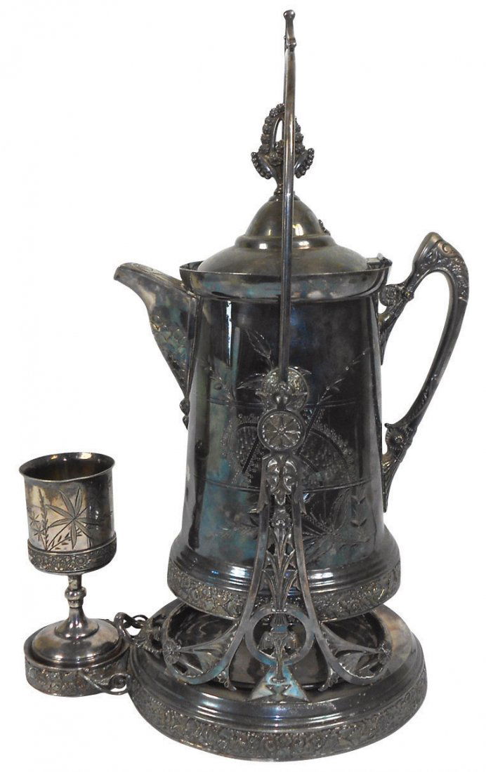 1067 Victorian tilting water pitcher on stand, silver