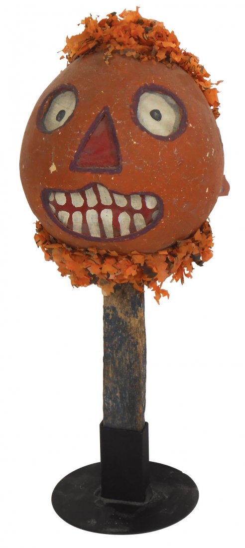 Halloween rattle, Jack-O-Lantern, papier-mâché w/: Halloween rattle, Jack-O-Lantern, papier-mâché w/paper insert & tissue trim on wood stick, one-of-a-kind, early 1900's, Exc cond w/orig paint, 12"H x 5"W.