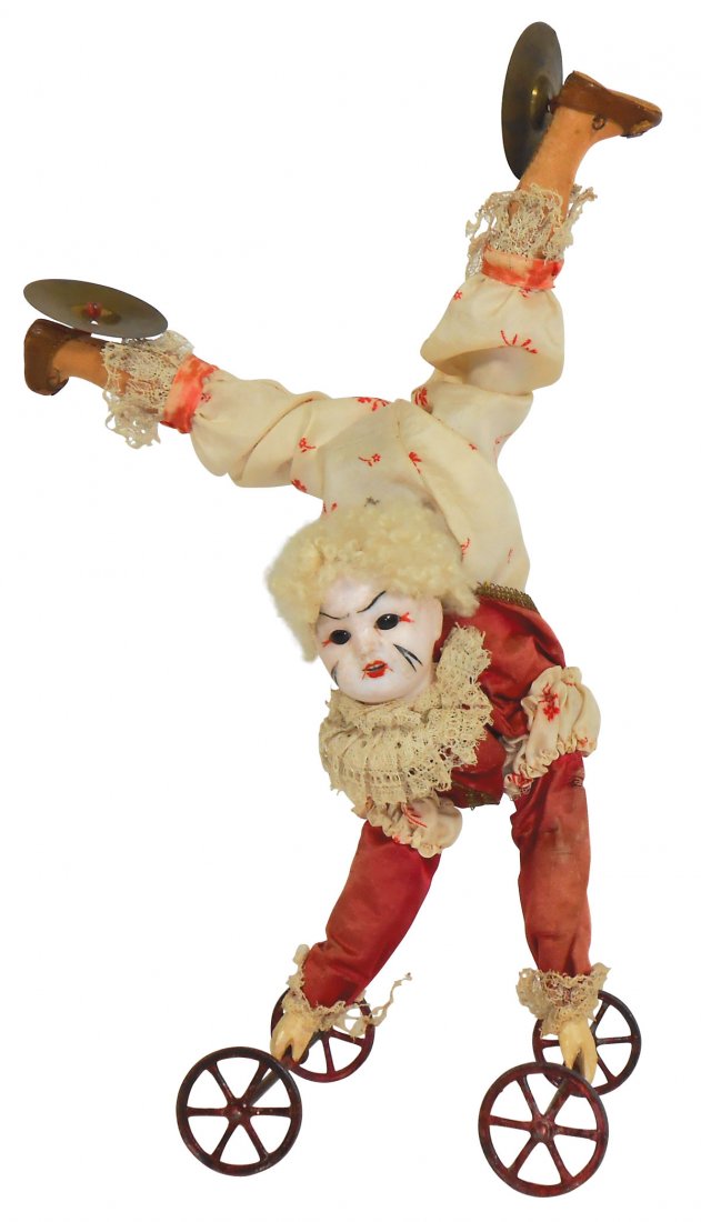 Toy, acrobat automaton, German bisque head clown: Toy, acrobat automaton, German bisque head clown w/glass eyes performing a rolling handstand while clashing cymbals attached to her kid slippers, probably made for Zinner, Gottlief & Sohne, winds but