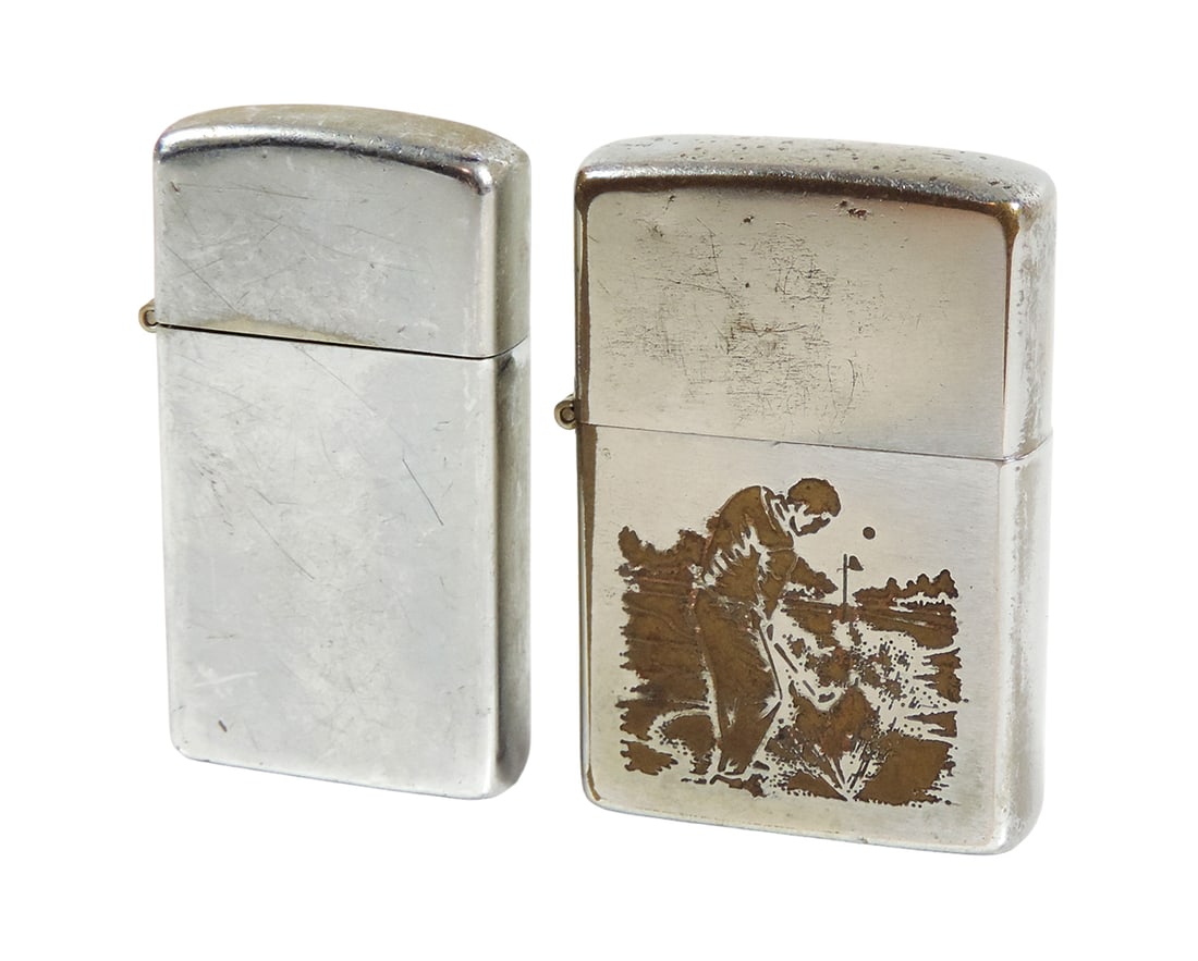 Vintage Lighters (2), both Zippo, one w/engraved golfer, other a Slim Line,: Vintage Lighters (2), both Zippo, one w/engraved golfer, other a Slim Line, both chrome in VG cond, golfer w/plating loss on back, 2.25"L.