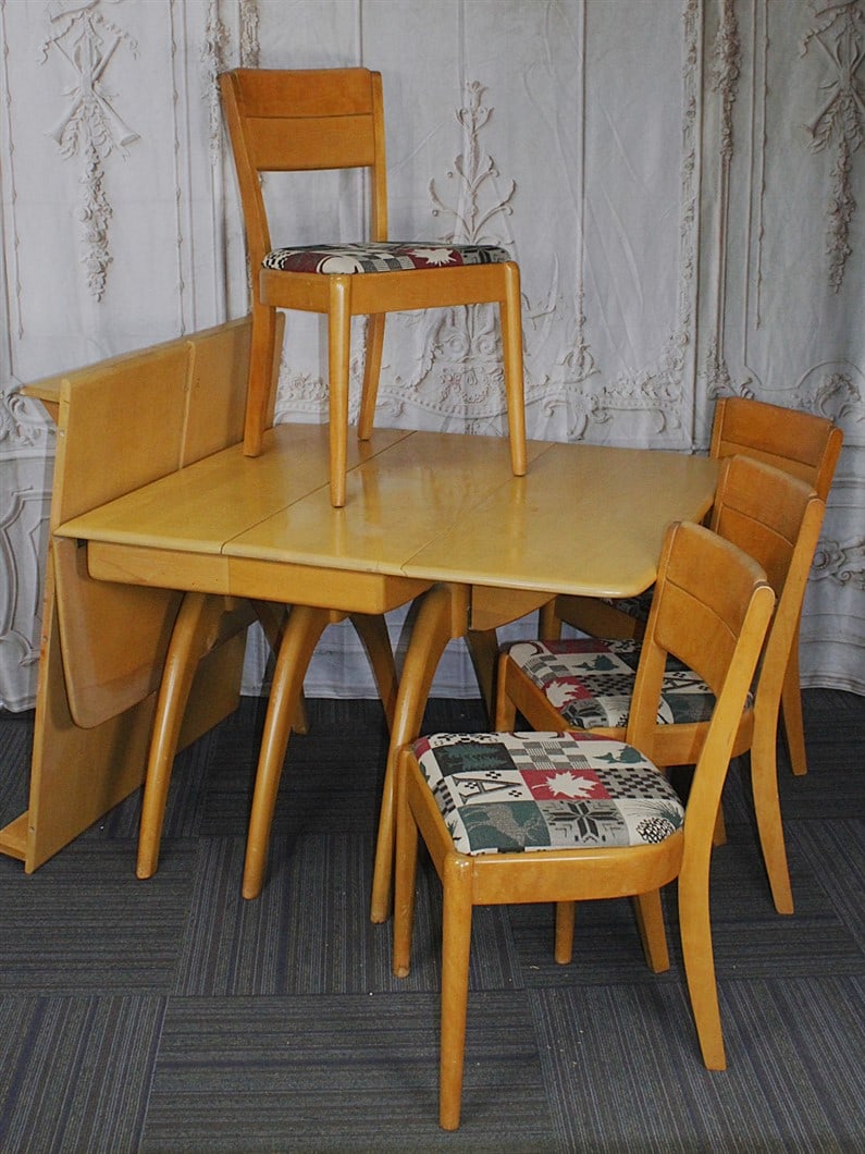 A Heywood-Wakefield "Spider Leg" drop leaf dining table in Champagne w/two leaves and 6 associated (1 of 1)