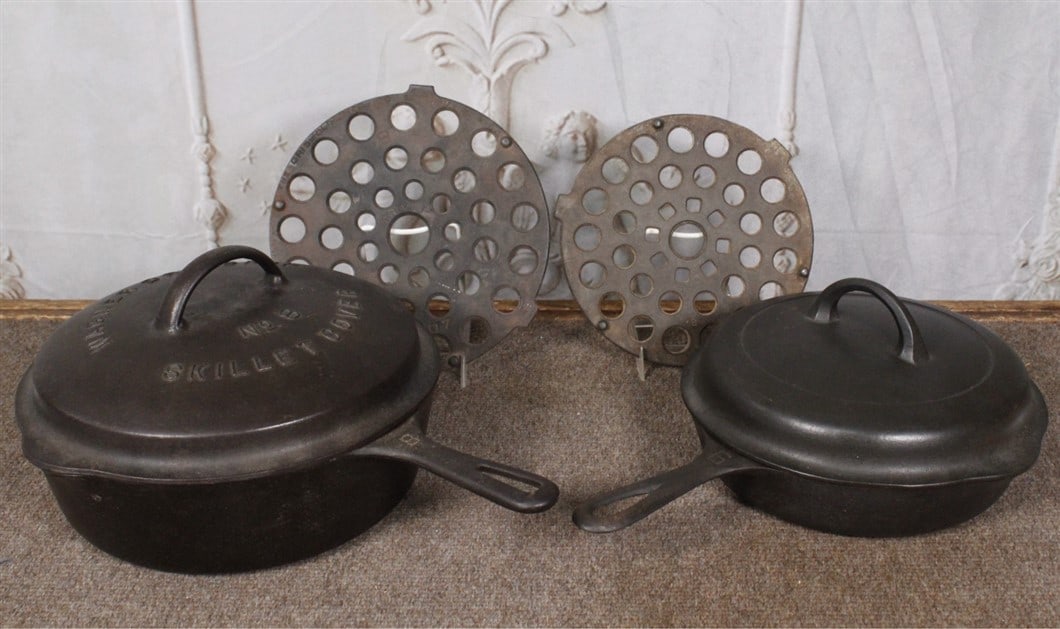 A Wagner #8 deep skillet w/lid and a Griswold #6 skillet w/lid, Exc cond. Larger 15"L. (1 of 1)