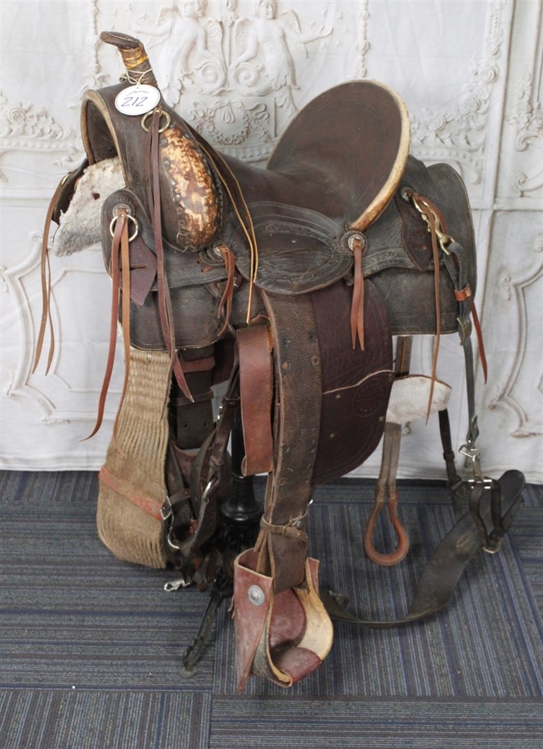An Antique Man's Western Saddle, 14" high-back seat w/tooled borders. G+ cond. 24"L. (1 of 1)